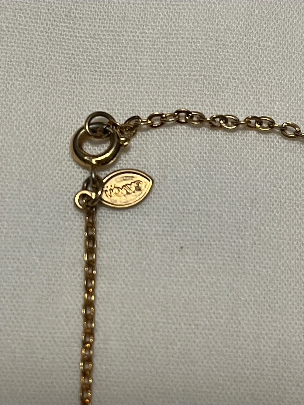Avon gold tone